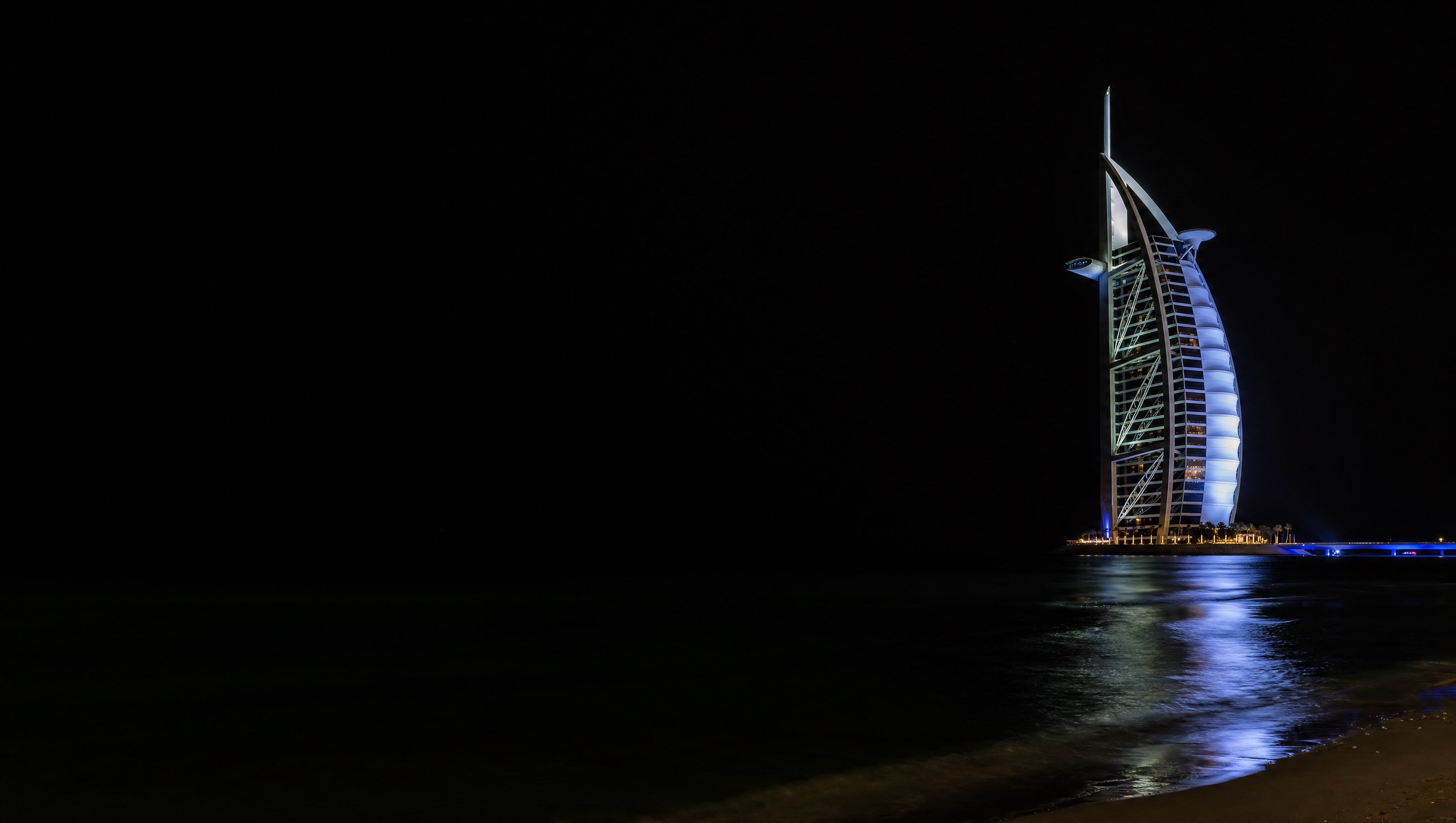 Burj Al Arab at night, seen from the beach
